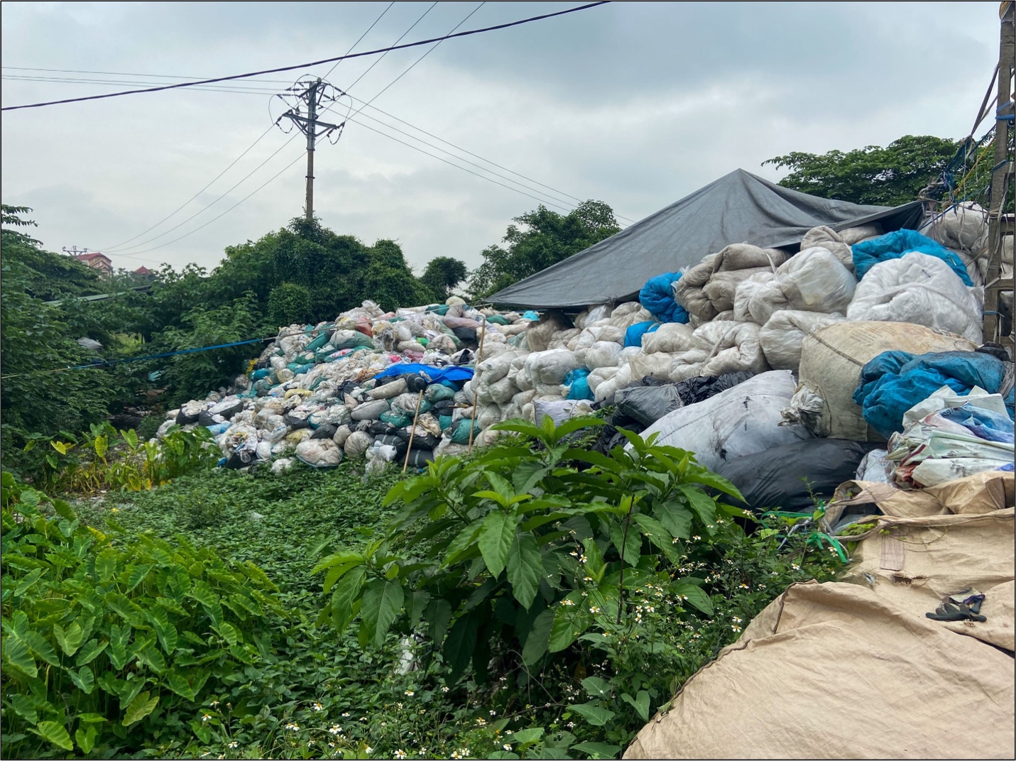 Plastic waste piled high in Minh Khai, Vietnam. The European Union exports vast amounts of plastic waste to countries like Vietnam. Much of this is not recycled and is burned or dumped.