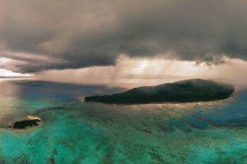 Rain over a tropical island in the South Pacific in April 2025. Image by Rhett A. Butler/Mongabay.