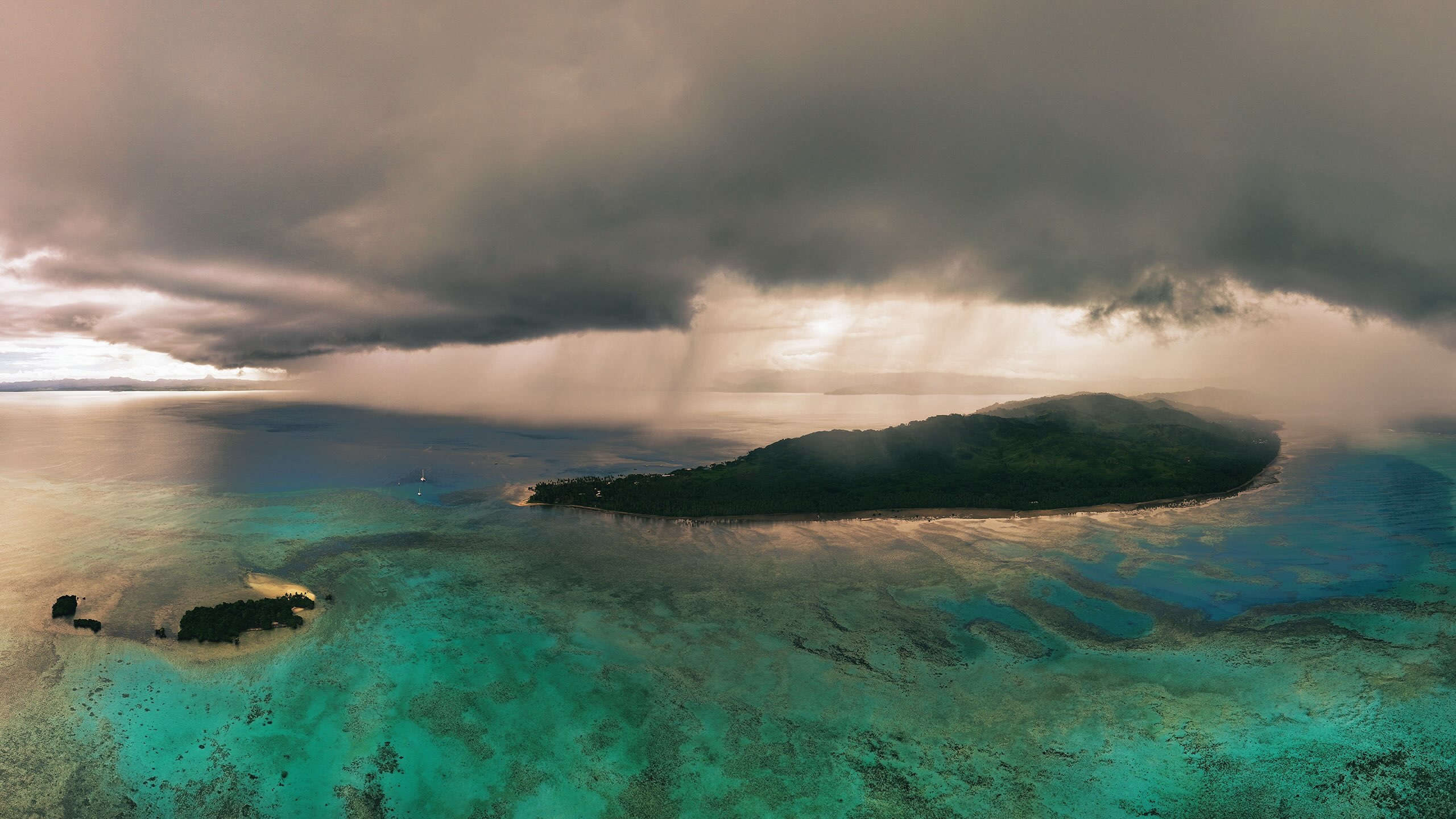Rain over a tropical island in the South Pacific in April 2025. Image by Rhett A. Butler/Mongabay.