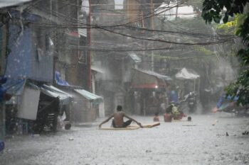 Banner image of a heavy downpour after Tropical Storm Wipha caused intensified monsoon rains in Quezon City, Philippines, on July 21. Image by AP Photo/Aaron Favila.