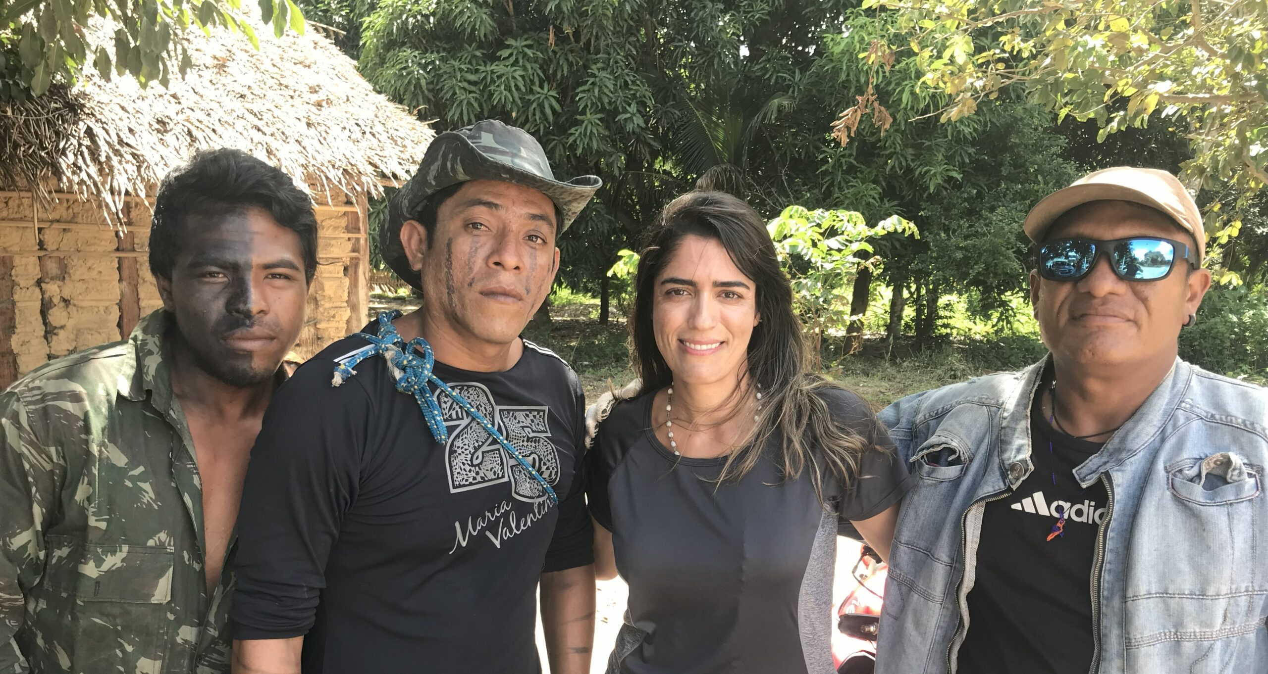 Paulo Paulino Guajajara, from left, with Laércio Guajajara, Karla Mendes and Olimpio Guajajara during Mendes's 2019 reporting trip. Paulo was killed in an ambush nine months later. Image by Karla Mendes/Mongabay.