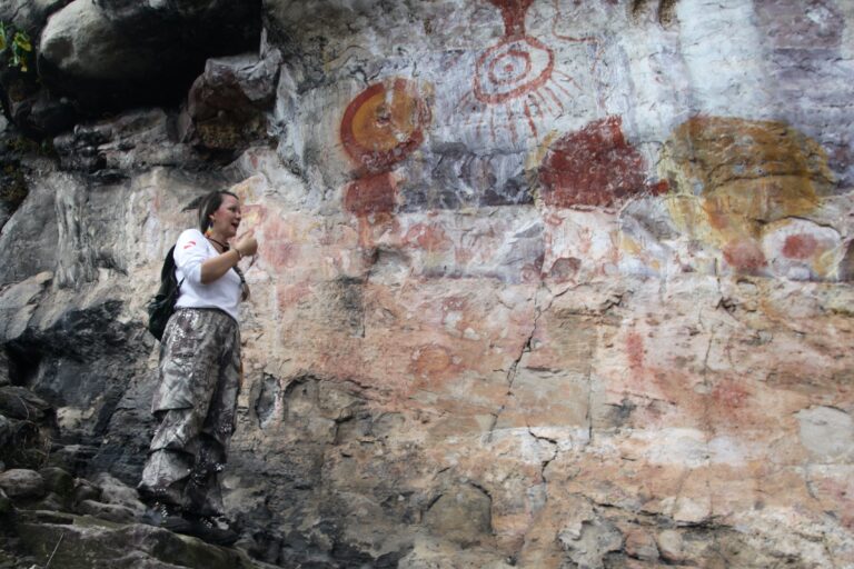 Park guide Luana Wanessa Assunção points at the remarkable Painel do Pilão, which could be the first-ever solar calendar of the Americas.