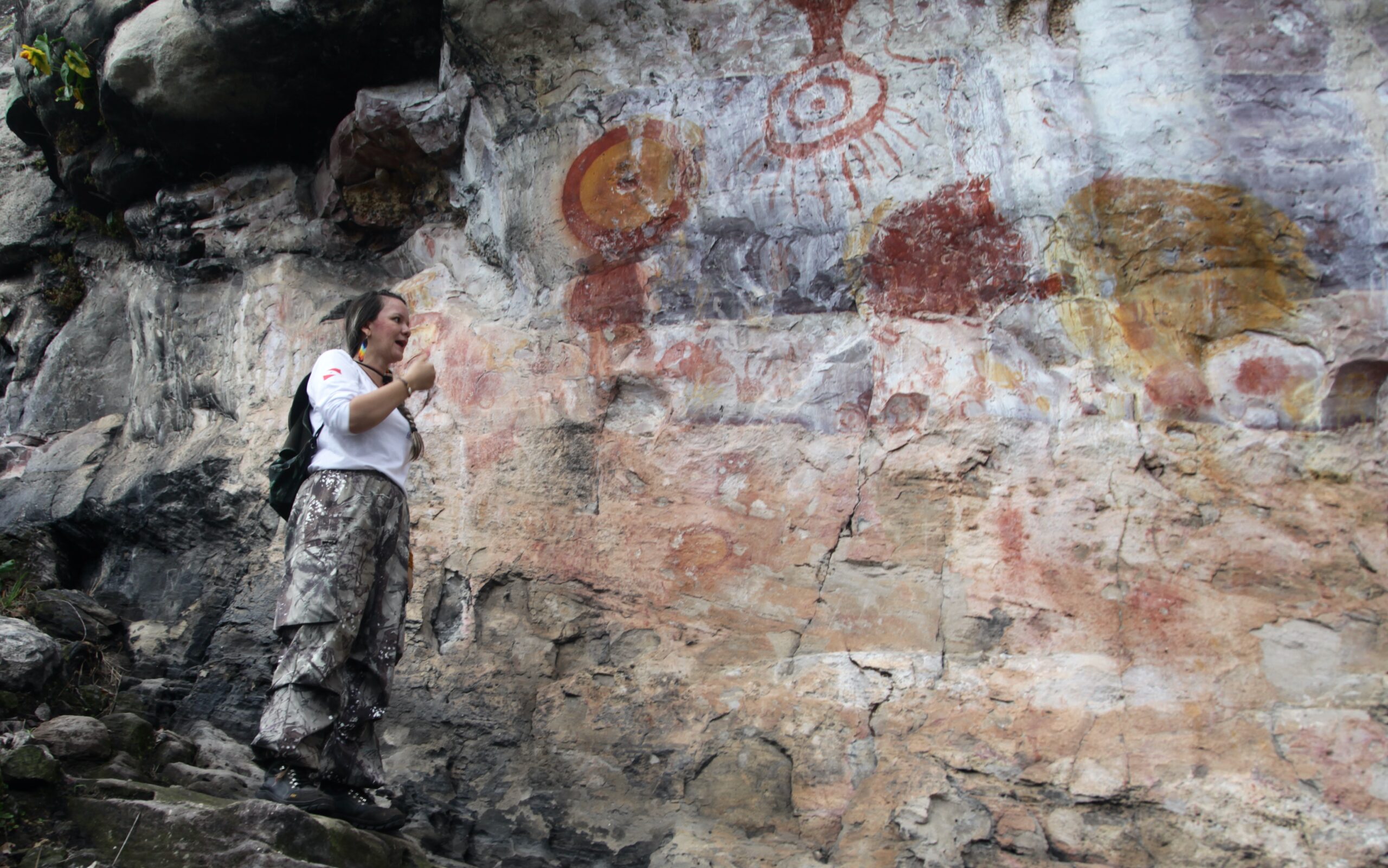 Park guide Luana Wanessa Assunção looks to Serra da Lua, or “Moon Mountain,” where the famous image of the sun and moon is found. Image by Peter Speetjens.