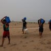 Residents transport drinking water from Humaita to the Paraizinho community, along a dry part of the Madeira River, a tributary of the Amazon River, amid a drought, Amazonas state, Brazil, Sep. 8, 2024. (AP Photo/Edmar Barros, File)