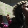 Waorani Indigenous people protest outside the Constitutional Court for their right to consultation before bidding for the exploration and exploitation of oil and gas on their territory in Quito, Ecuador. (AP Photo/Dolores Ochoa)