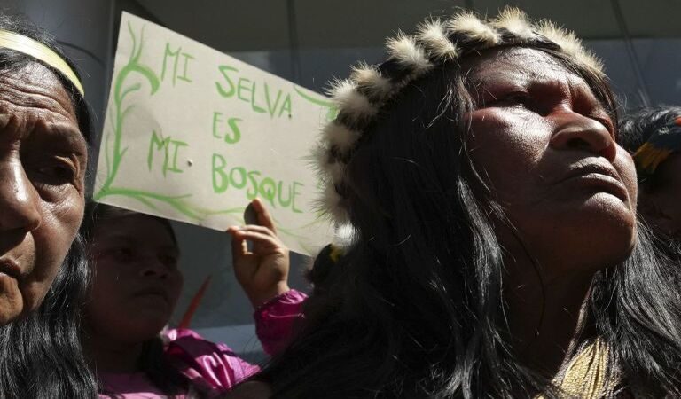 Waorani Indigenous people protest outside the Constitutional Court for their right to consultation before bidding for the exploration and exploitation of oil and gas on their territory in Quito, Ecuador. (AP Photo/Dolores Ochoa)