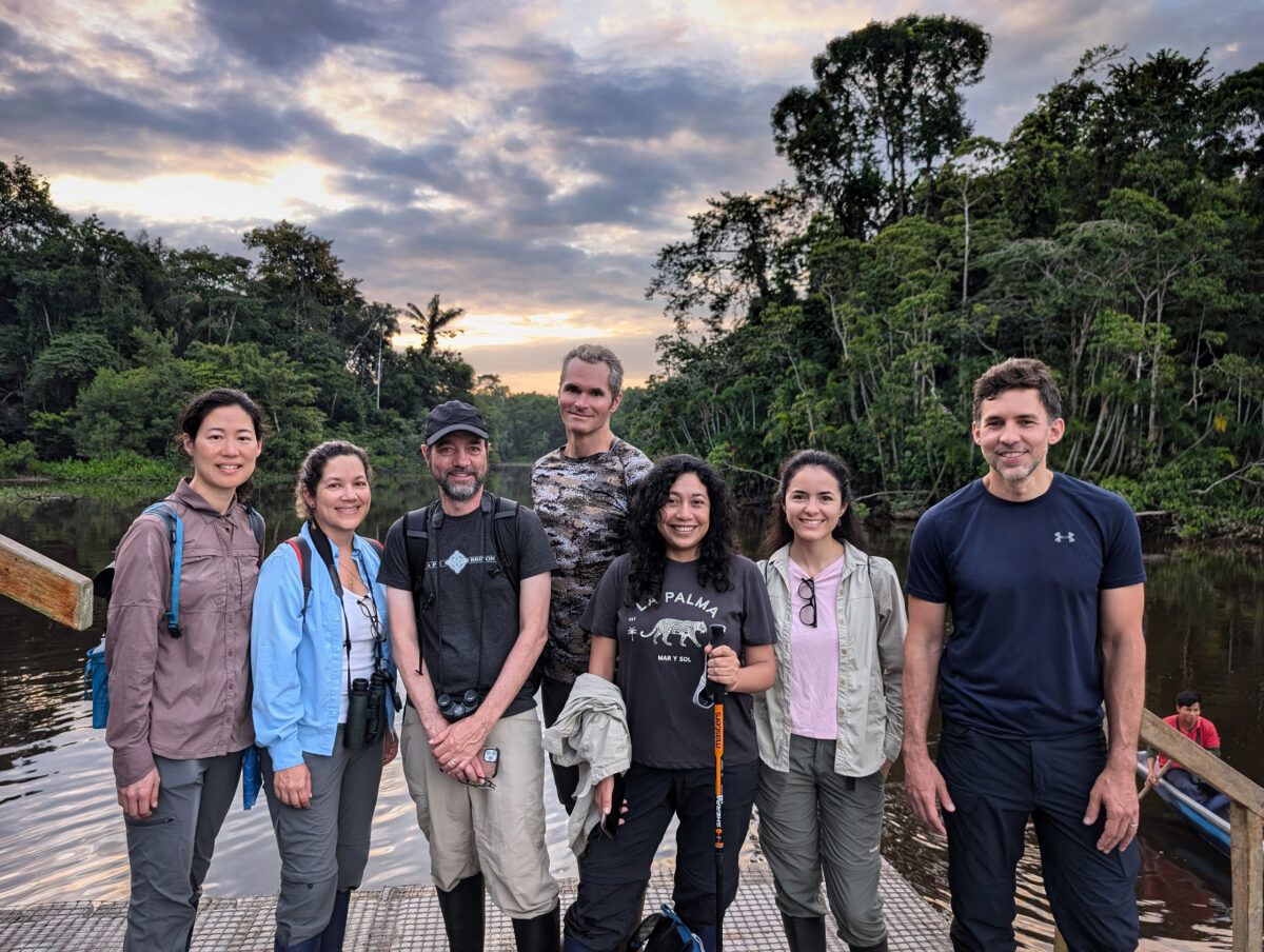 Torres, center with a black shirt, in the Ecuadorian Amazon with other Mongabay staffers in 2024. Photo by Mongabay.
