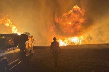 A crew of firefighters fights the Vees Fire near Ten Sleep, Wyoming, in July 2025.