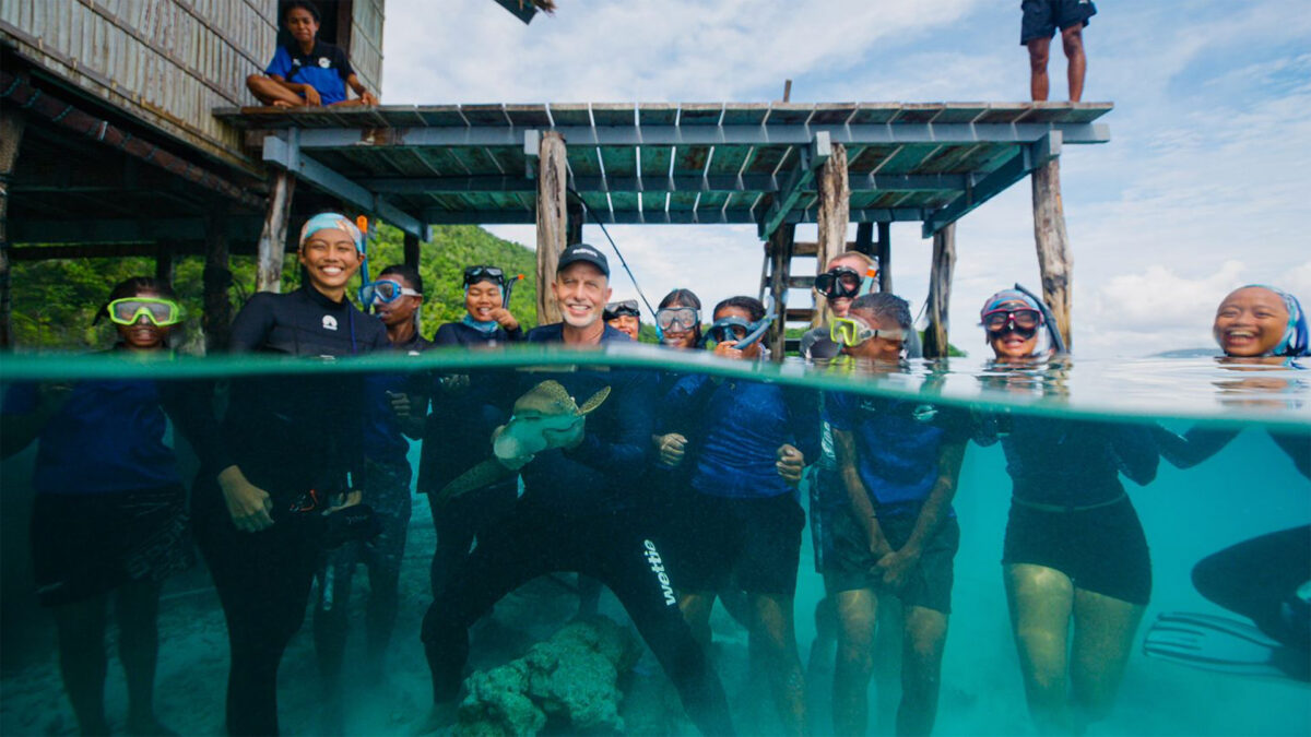 Can we undo extinction? A growing effort to restore lost sharks 3 Indonesia Program Manager Nesha Ichida, Erdmann and the RARCC Shark Nannies release a pup at Kri Island as students from Child Aid Papua look on. Photo by Luca Vaime/Indo-Pacific Films.