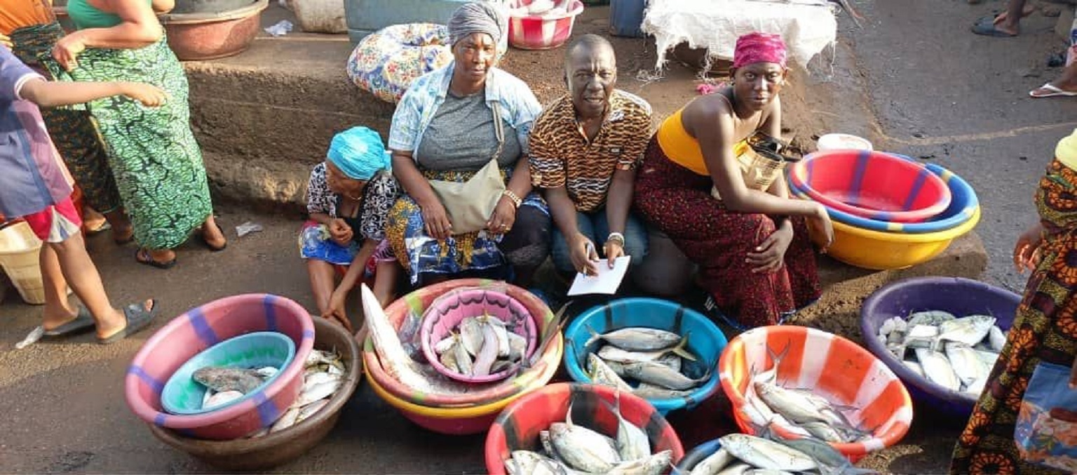 Women in Sierra Leone selling fish at the market in Mama Beach. As climate change strips away the income from tropical fisheries, many fishing communities are facing "the erosion of community and cultural knowledge."