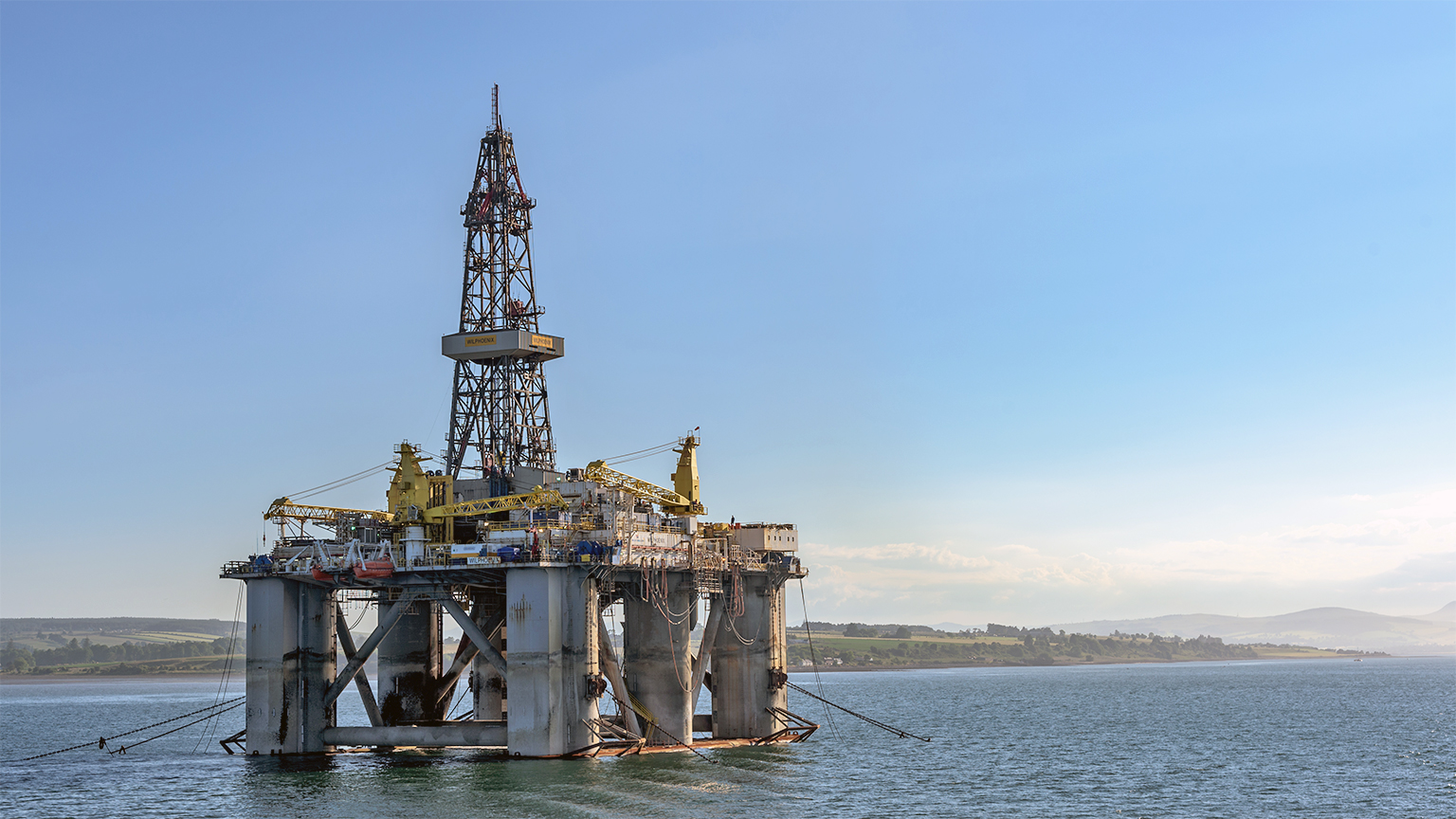 An oil rig sits in Cromarty Firth, Scotland.
