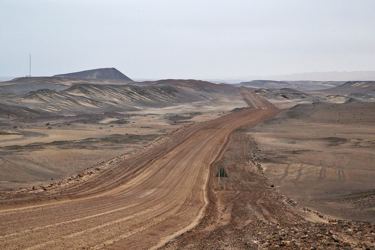 The bare roads of the hyper-arid Skeleton Coast National Park that hugs the coast of Namibia.