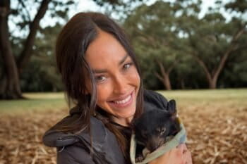 Natalie Kyriacou holding a Tasmanian devil. Image courtesy of Natalie Kyriacou.