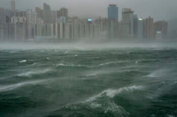 Banner image of waves near Hong Kong’s Victoria Harbour following Typhoon Wipha, July 20, 2025. Image by AP Photo/Vernon Yuen.