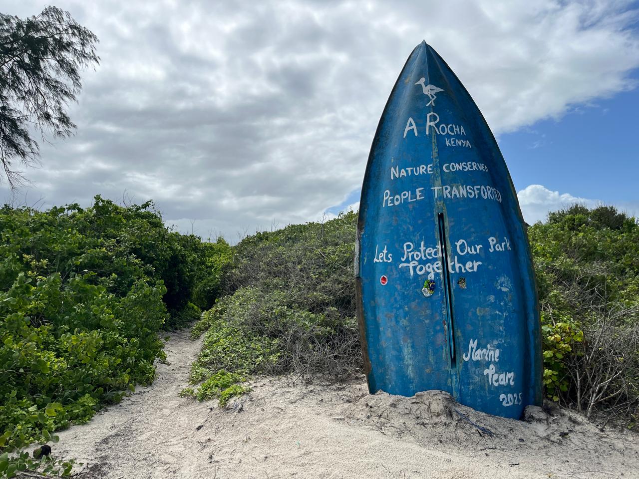 A boat-turned-signboard for A Rocha Kenya.