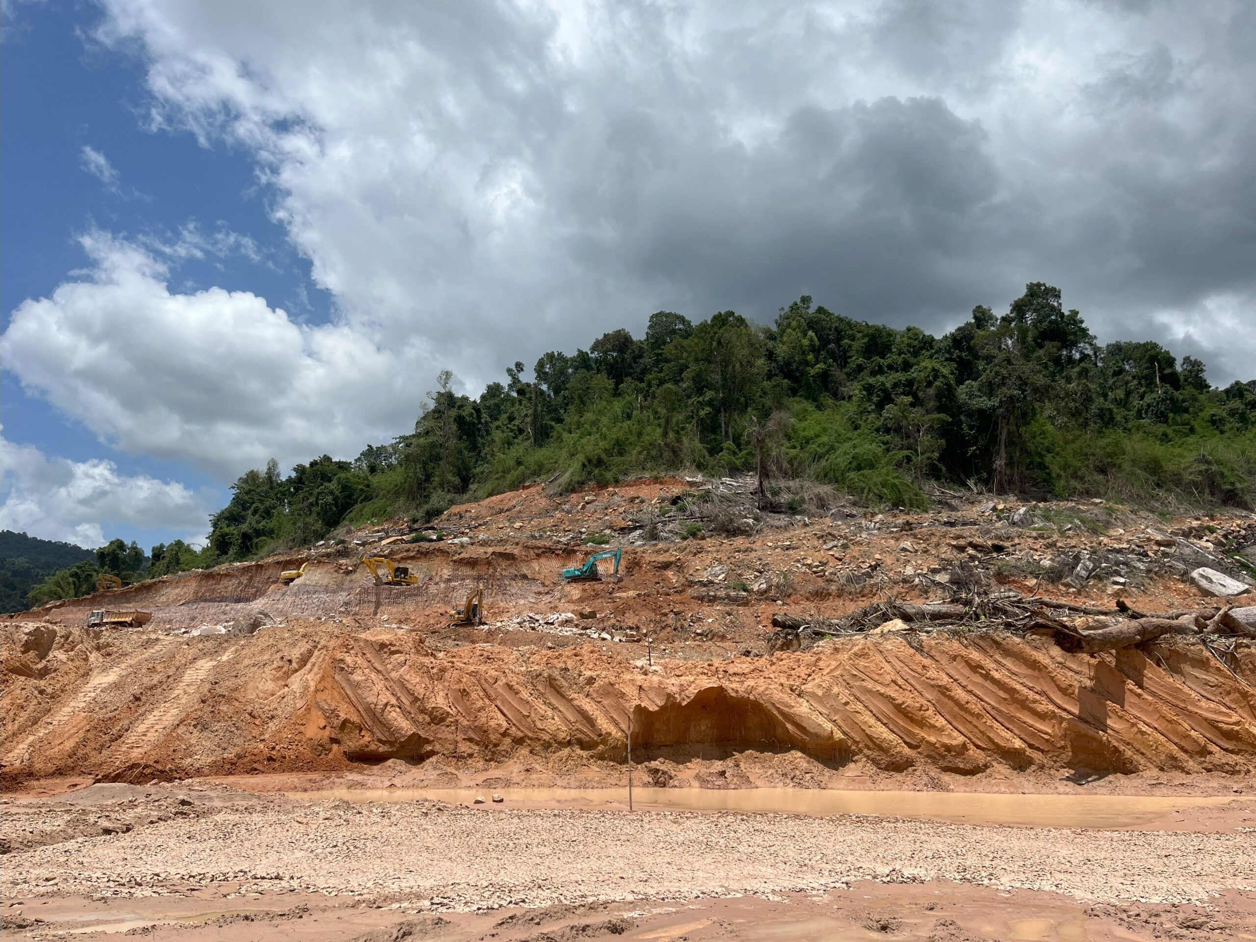 Authorities say the new irrigation dam will reduce flooding and provide water to farmers, but local residents fear the loss of their forests and access to free-flowing water. Image provided by source.