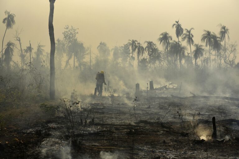 In this Sep. 26, 2017 photo released by Ibama, the Brazilian Environmental and Renewable Natural Resources Institute, members a firefighter fighta a forest fire affecting Porquinhos Indigenous lands in Maranhao state in Brazil's Amazon basin. Image by Felipe Werneck/Ibama via AP.
