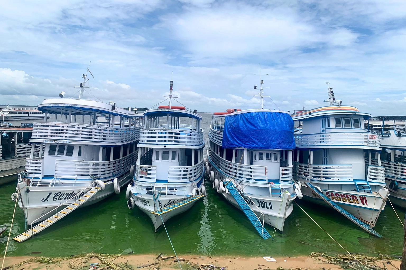 Ferry boats lie neatly lined up at the Tapajós River port.