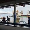Seen through Santarém’s fish auction: ocean-faring vessel being loaded at the Cargill soy terminal.
