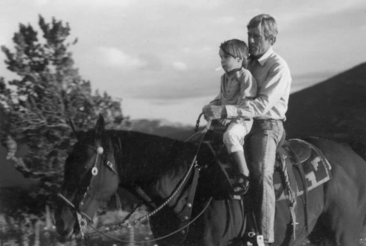 Redford and grandson Conor Schlosser at Sundance Ranch, 1997. Courtesy of Robert Redford. Via Orion.