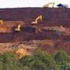 Heavy machinery operates at the nickel mining site of PT Kawei Sejahtera Mining on Kawe Island, Raja Ampat.