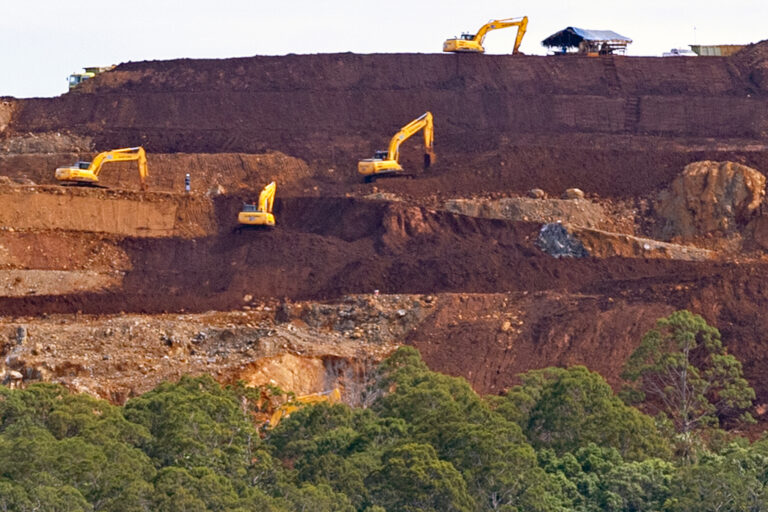Heavy machinery operates at the nickel mining site of PT Kawei Sejahtera Mining on Kawe Island, Raja Ampat.