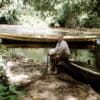 A young Rostain takes a break along a river in French Guiana, where he started his archaeological career in the late 1980s.