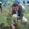 A participant plants local green plants in a park as part of Ethiopia's Green Legacy Initiative, which aims to plant 7.5 billion trees by the end of the year, at Jifara Ber site, Addis Ababa, Ethiopia, Thursday, July 31, 2025.