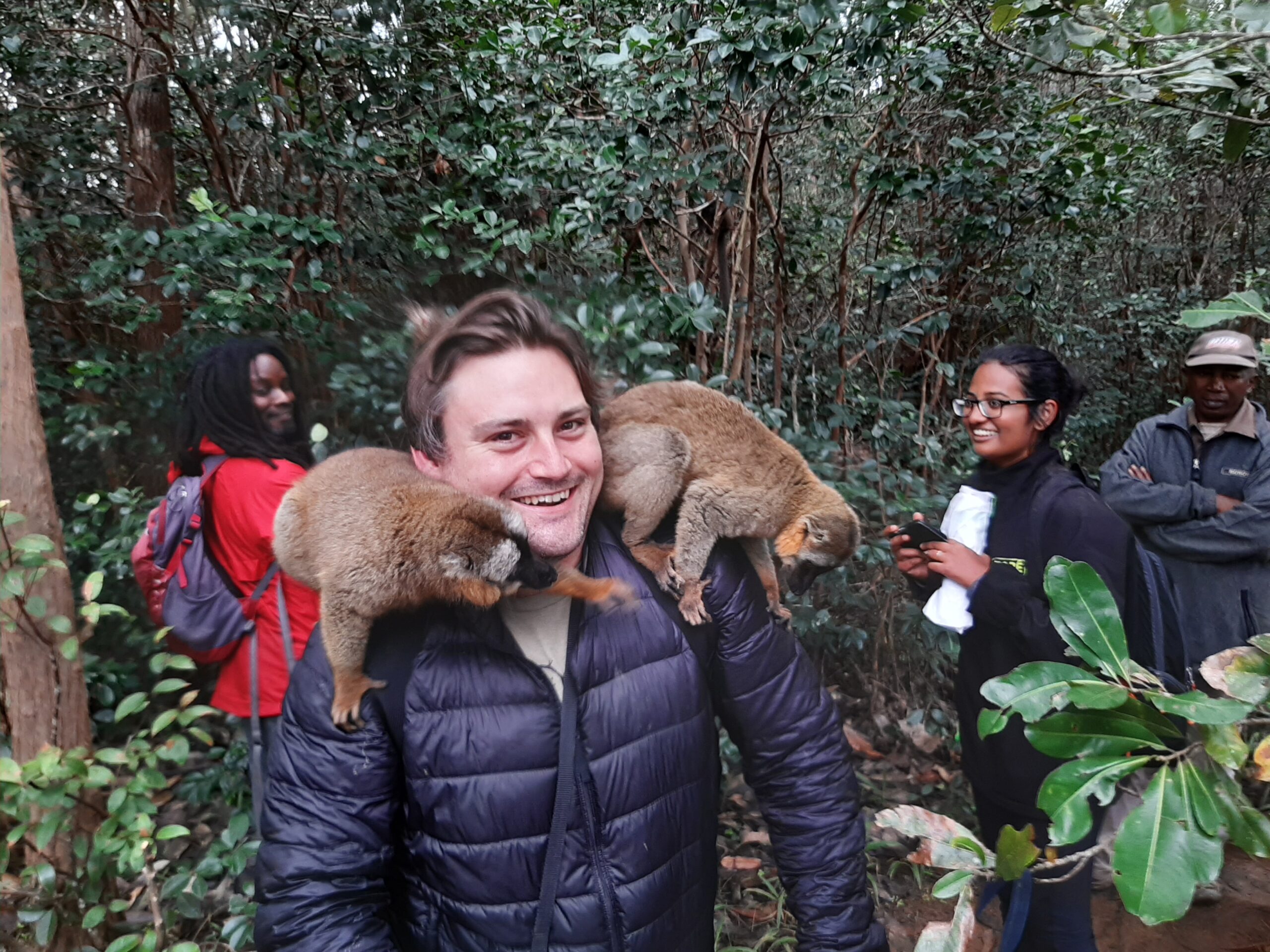 Willie Shubert in Madagascar with lemurs at a rehabilitation center. Note: visitors are not permitted to touch lemurs, but lemurs do as they please. Photo by Rhett Ayers Butler