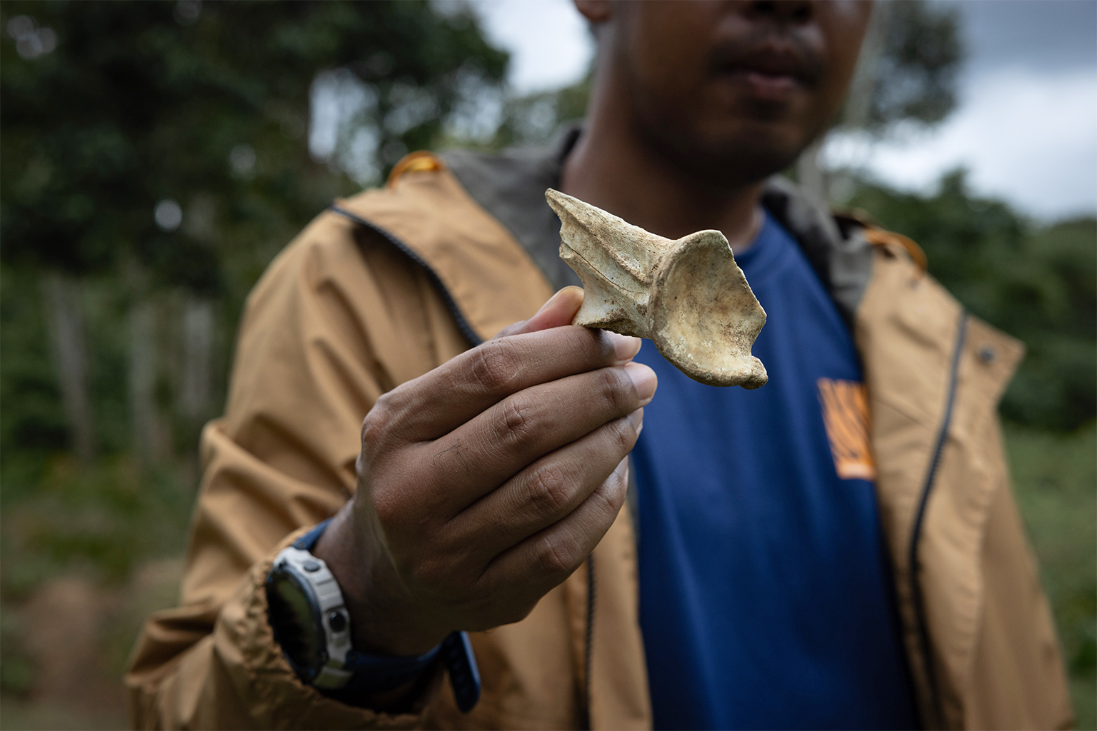 Chalong Thongsong holds up a sambar deer bone.