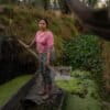 Cassandra Garduño in a wooden boat.