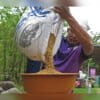 Paddy farmer Azhar Hashim refills paddy grains into a miller at an independent farmers’ mini carnival.