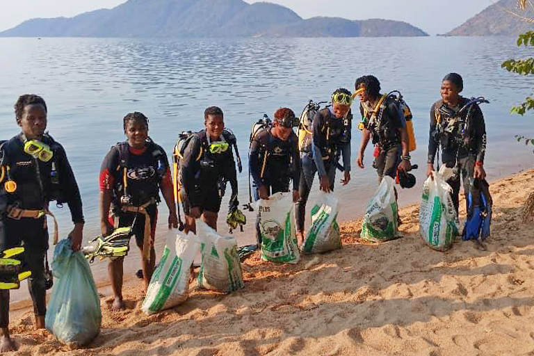HEEED’s underwater garbage cleanup initiative has trained youth from the beach village to dive. They not only help remove garbage but are earning a living as underwater tour guides in Cape Maclear, one of Malawi’s tourism hotspots. Image courtesy of HEEED.