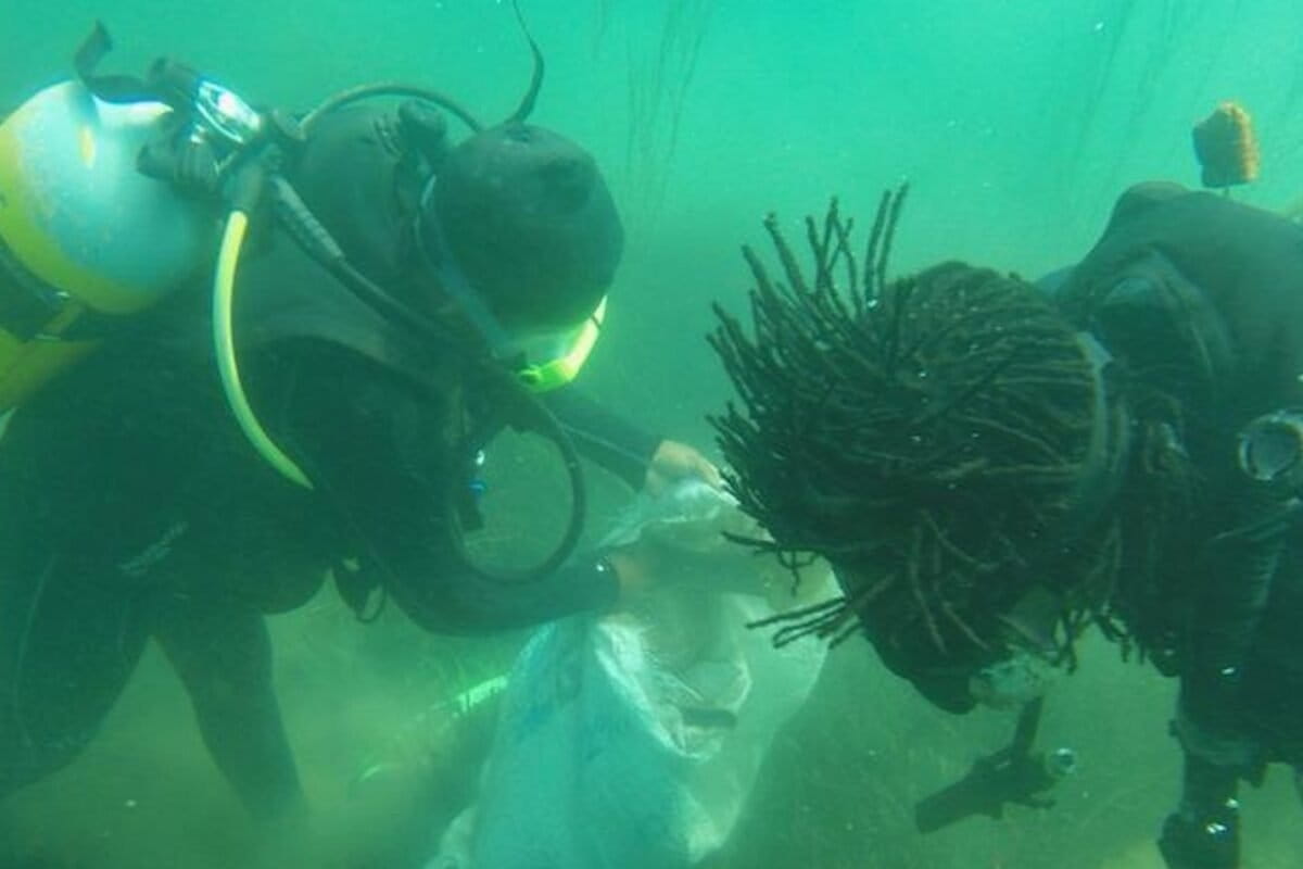 photo of Local divers pick away at Lake Malawi’s underwater garbage problem image