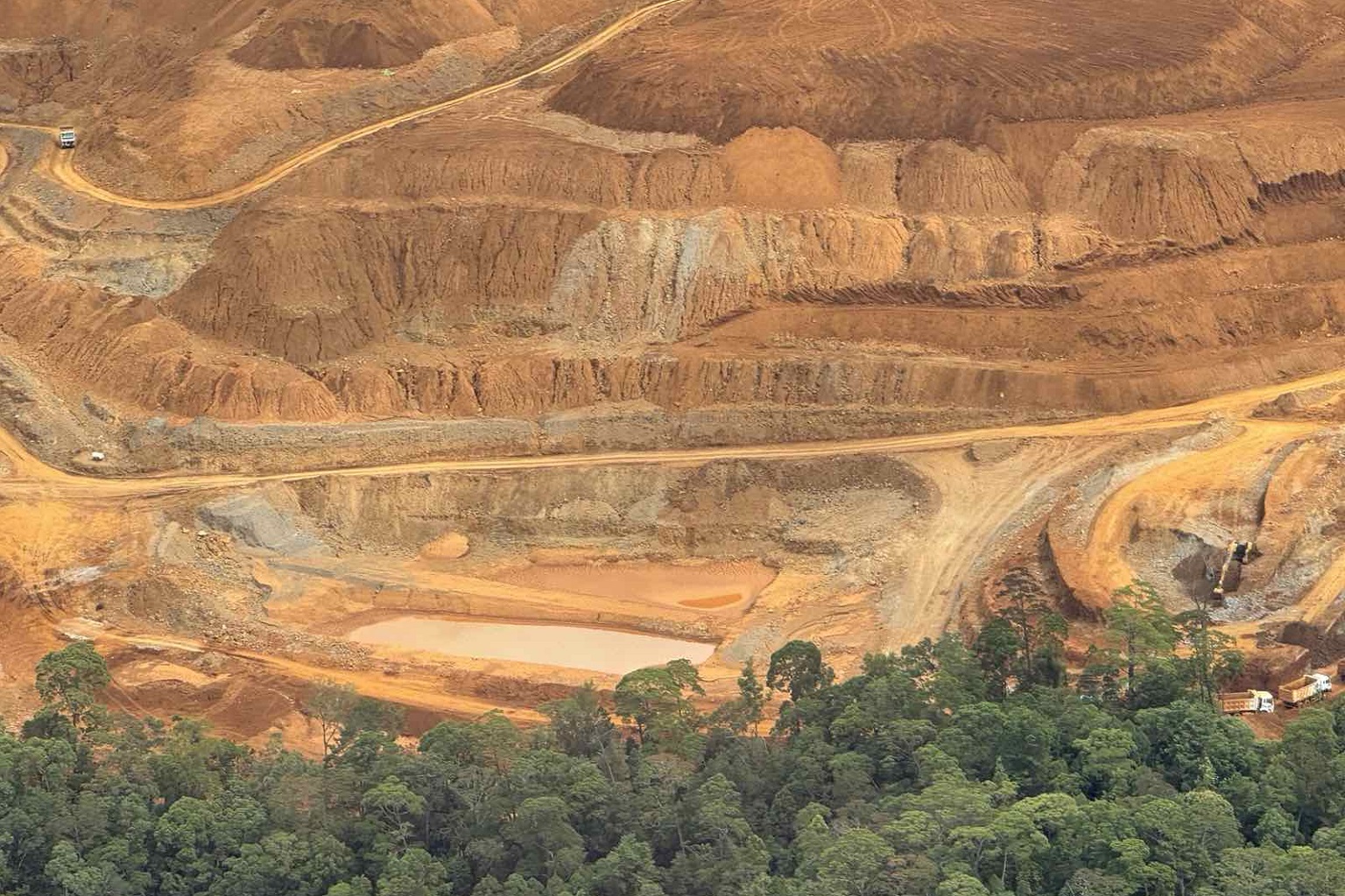 The Pujada Nickel Mining Project leaves an open-wide brown pit, sandwiched between the Mount Hamiguitan Range Wildlife Sanctuary and Pujada Bay.