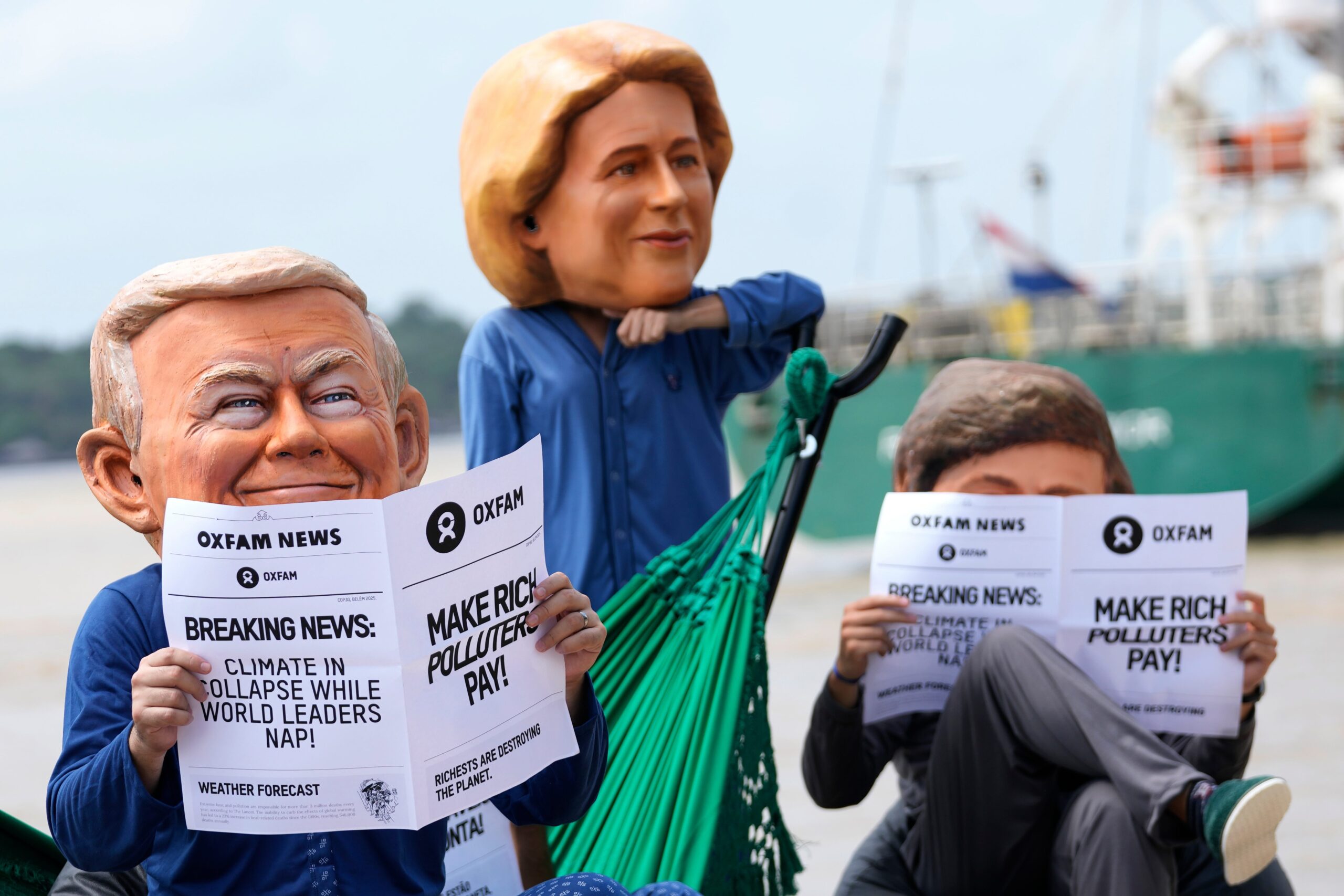 Oxfam activists wear puppet heads in the likeness of U.S. President Donald Trump, left, President of the European Commission Ursula von der Leyen, center, and President of Argentina Javier Milei as they protest ahead of the COP30 U.N. Climate Summit in Belém, Wednesday, Nov. 5. Image by AP Photo/Eraldo Peres.