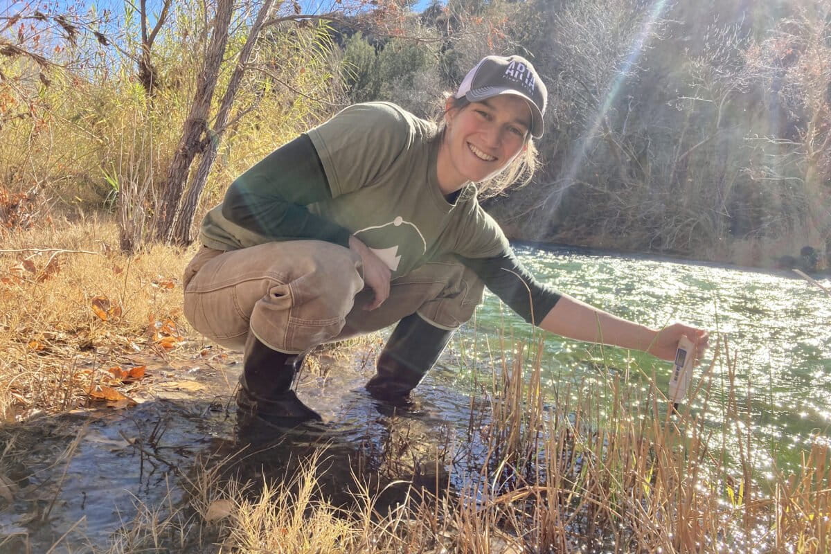 Noa Bruhis sampling on the Verde River in Arizona for the Wild and Scenic Rivers Project in December 2020. The project sought to address water quality data gaps and update the status of Wild and Scenic Rivers across the nation, improving how these river systems are managed and protected. Image by Noa Bruhis