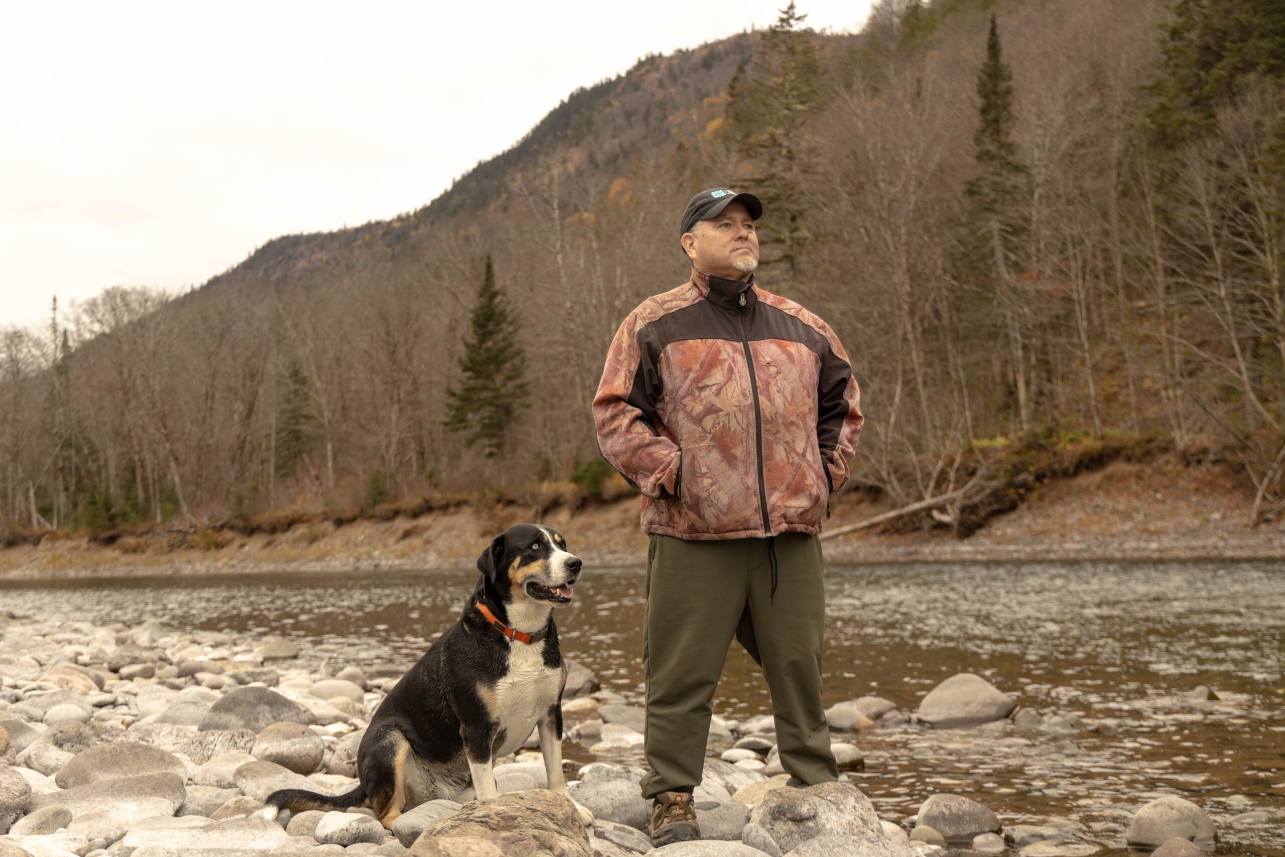 Stephen Jerome, respected elder of the Mi'kmaq of the eastern Canada region posing by the very river spot he was raised on as a child. Image by Boris R. Thebia.