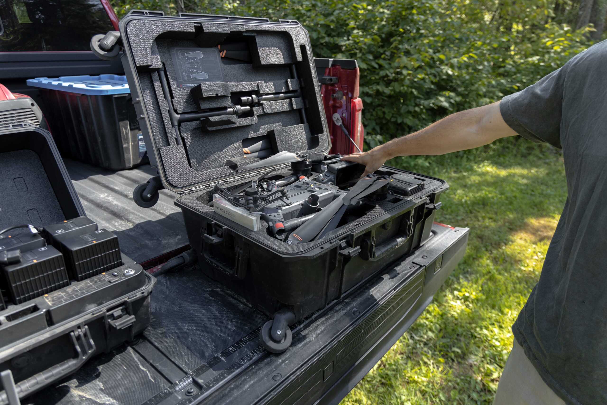 Samuel and Miguel assembling and operating the drone by the Cascapedia river. Image by Boris R. Thebia.