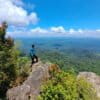 An Indigenous person gazes at the expanse of the Meratus mountains from the Hauk peak.