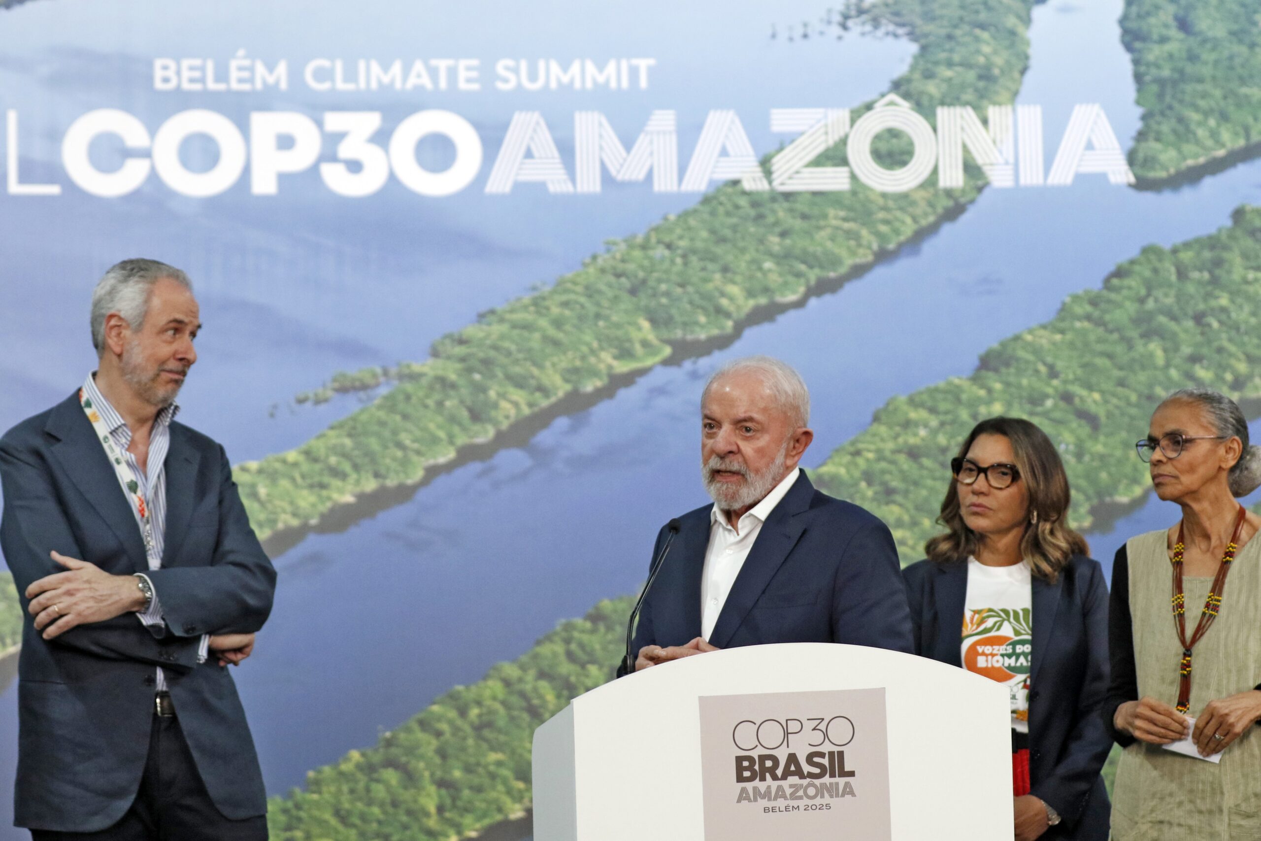 Brazilian President Luiz Inácio Lula da Silva, with COP30 President André Corrêa do Lago on his left and First Lady Janja Lula da Silva and Environment Minister Marina Silva on his right, speaks during a press conference after meetings at COP30. Image courtesy of Bruno Peres/Agência Brasil.