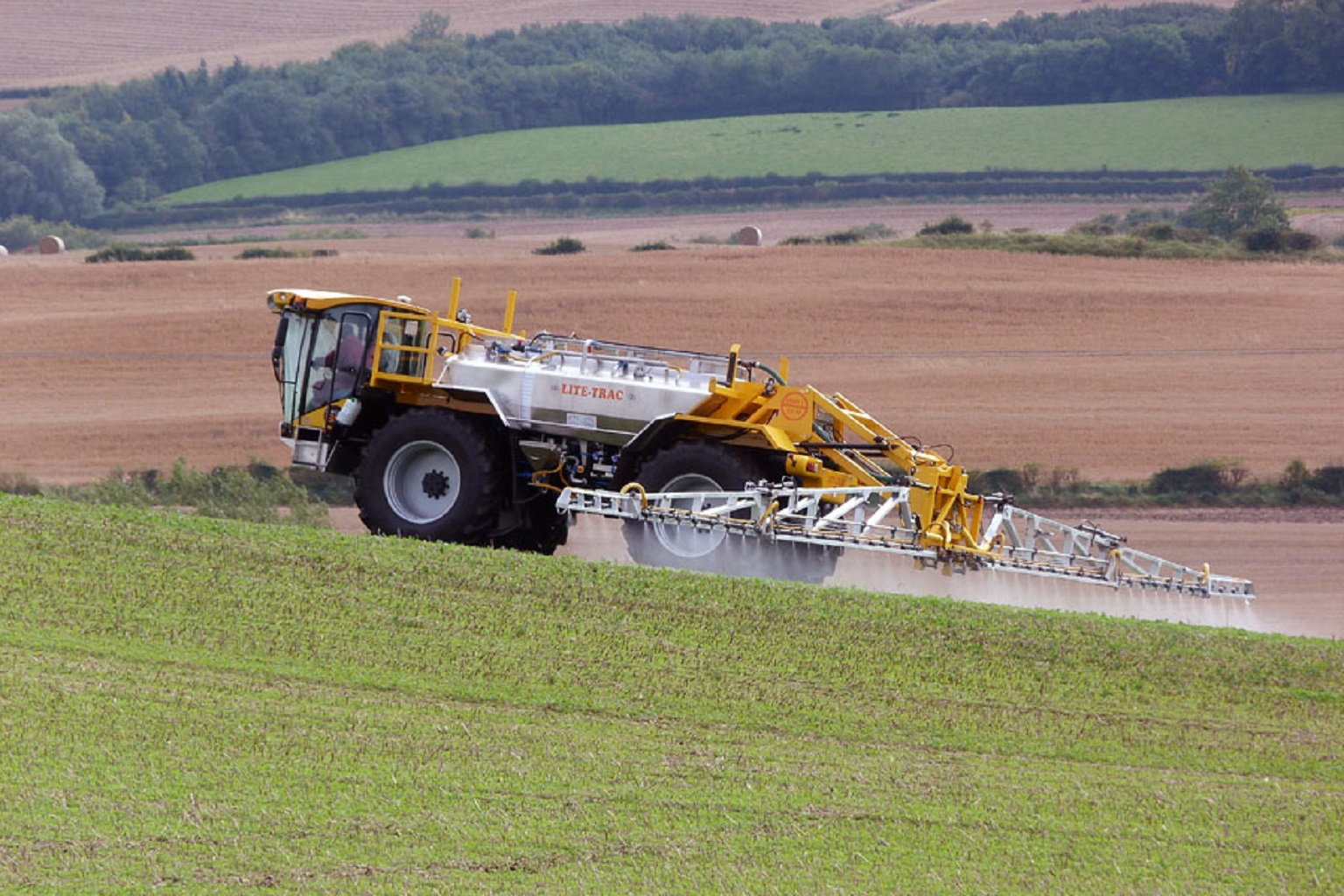 A self-propelled crop sprayer spreads pesticide on a field. More than 1,000 chemical pesticides are in use today globally, according to the World Health Organization.
