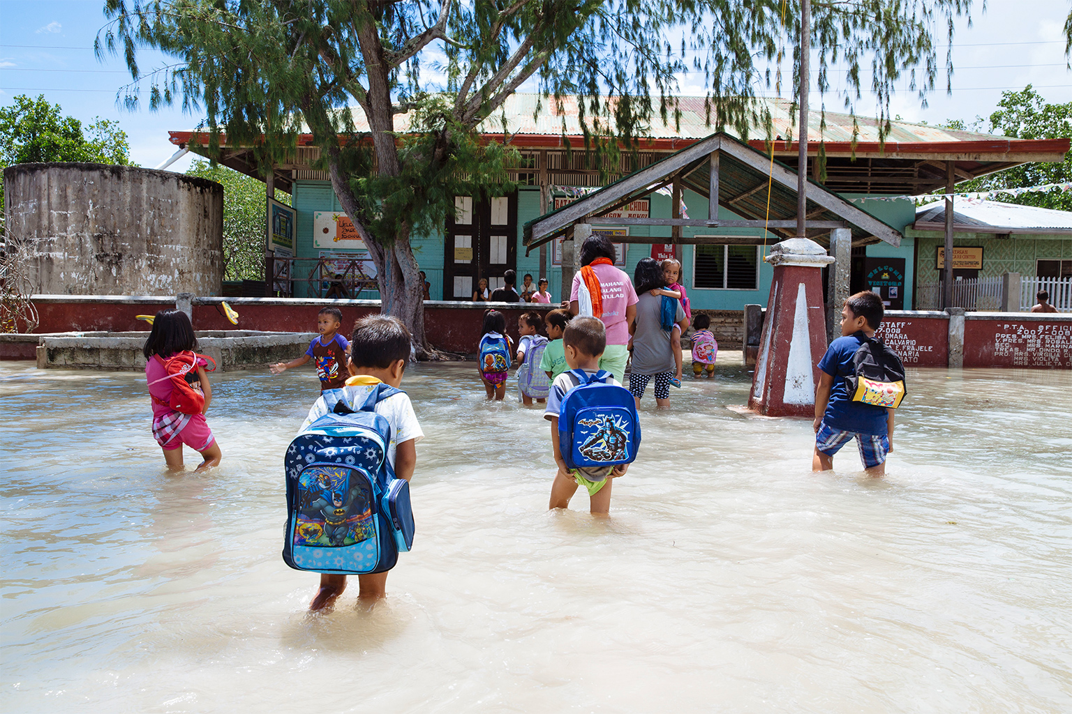 Seawater inundates Batasan Island and hampers day-to-day activities of about 800 residents.