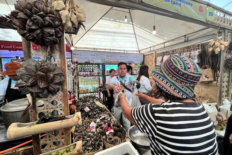 Seafood harvested by community-based Slow Food producers in the central Philippines is offered for sale at Terra Madre Asia & Pacific in Bacolod City. Image by Keith Anthony Fabro for Mongabay.
