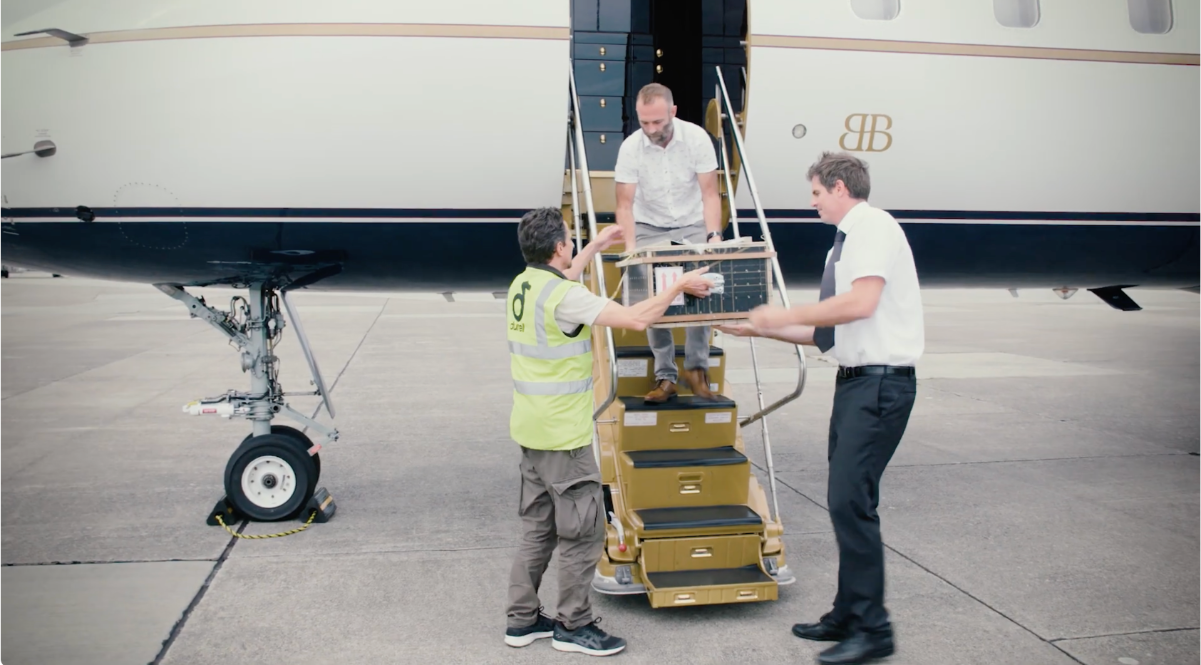 Matt Goetz and Chris Ransom from Durrell Wildlife Conservation Trust collecting the evacuated lesser night geckos at Jersey airport in 2020. Image courtesy of Durrell Wildlife Conservation Trust.