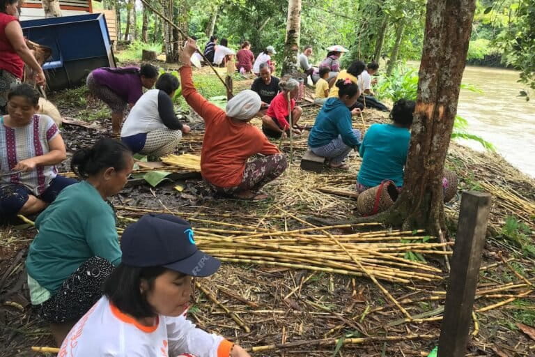 The Indigenous community of Long Isun in Kalimantan, Indonesia, derives many benefits from its territory including non-timber forest products. Here, women have harvested some sugar cane. Photo courtesy of the Long Isun community.