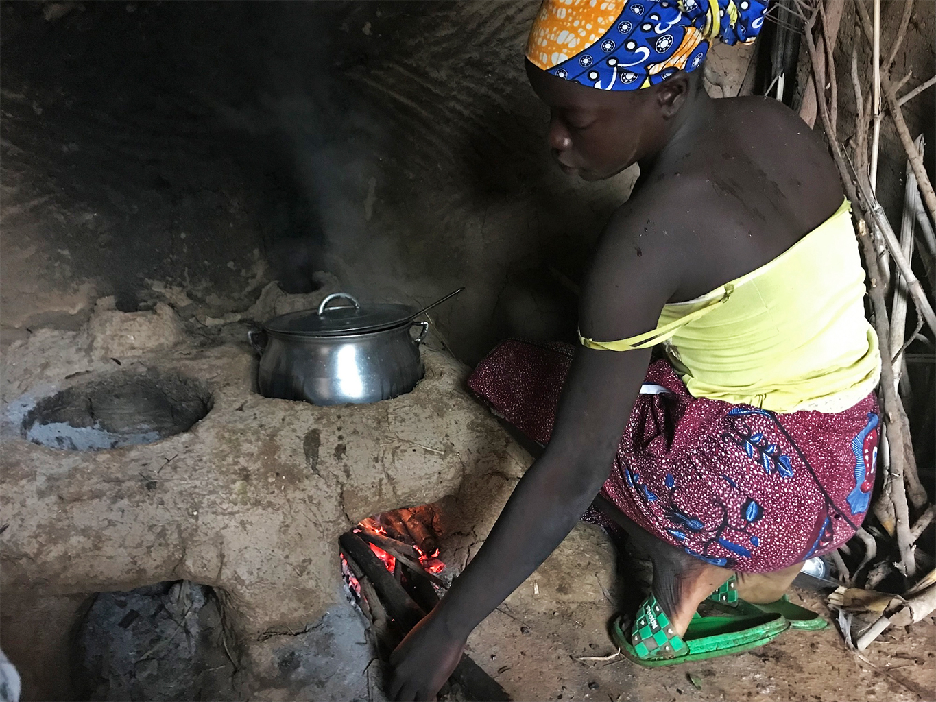 A woman uses a new cookstove in the village of Bang in the North region of Cameroon.