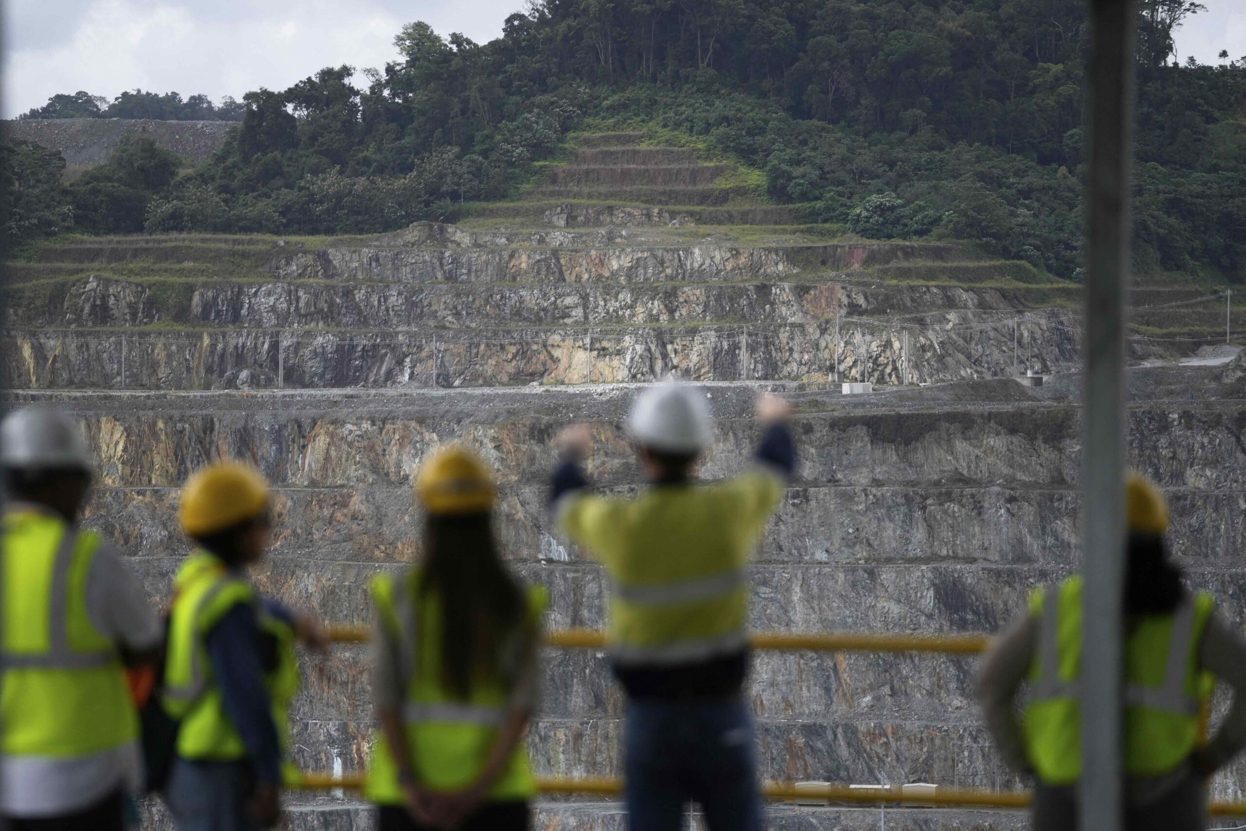 Visitors look at the Cobre Panamá copper mine, owned by Canada's First Quantum Minerals, in Donoso, Panama, Friday, March 21, 2025, during a press tour of the mine after it was closed by Panama's Supreme Court that ruled the government concession was unconstitutional. Image by AP Photo/Matias Delacroix.