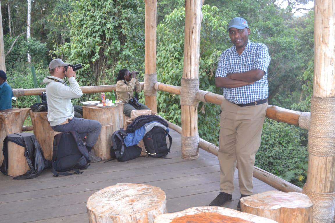 Twahirwa posing at Kuwinka, the main entrance for visitors at Nyungwe rainforest in southwestern Rwanda for field coverage. Image courtesy of Viateur Nzeyimana.