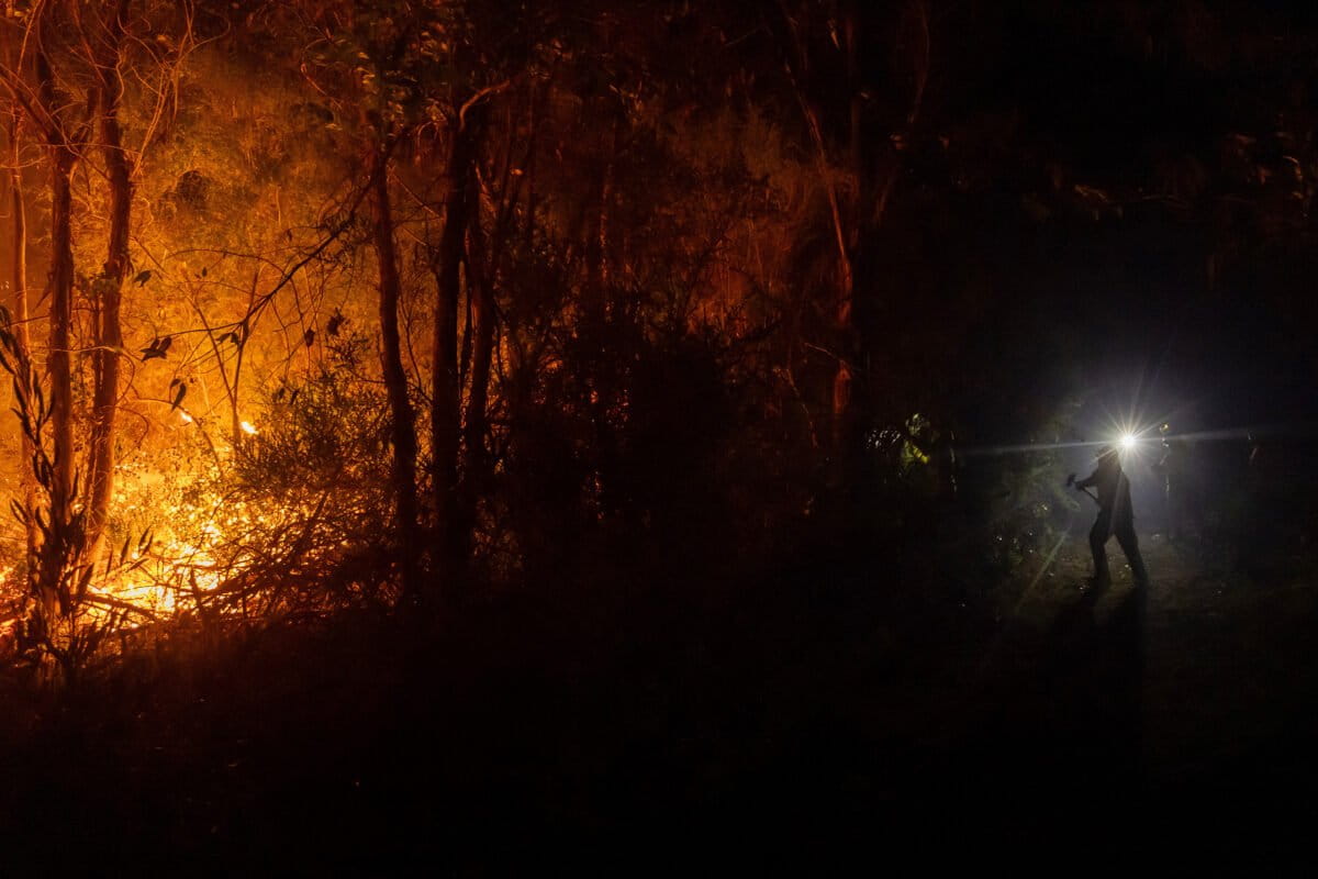Firefighters battle a wildfire spreading through a forested area near Concepcion, Chile, Tuesday, Jan. 20, 2026. (AP Photo/Javier Torres, File)